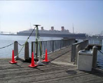 Wide shot of a tripod survey tool overlooking a pier